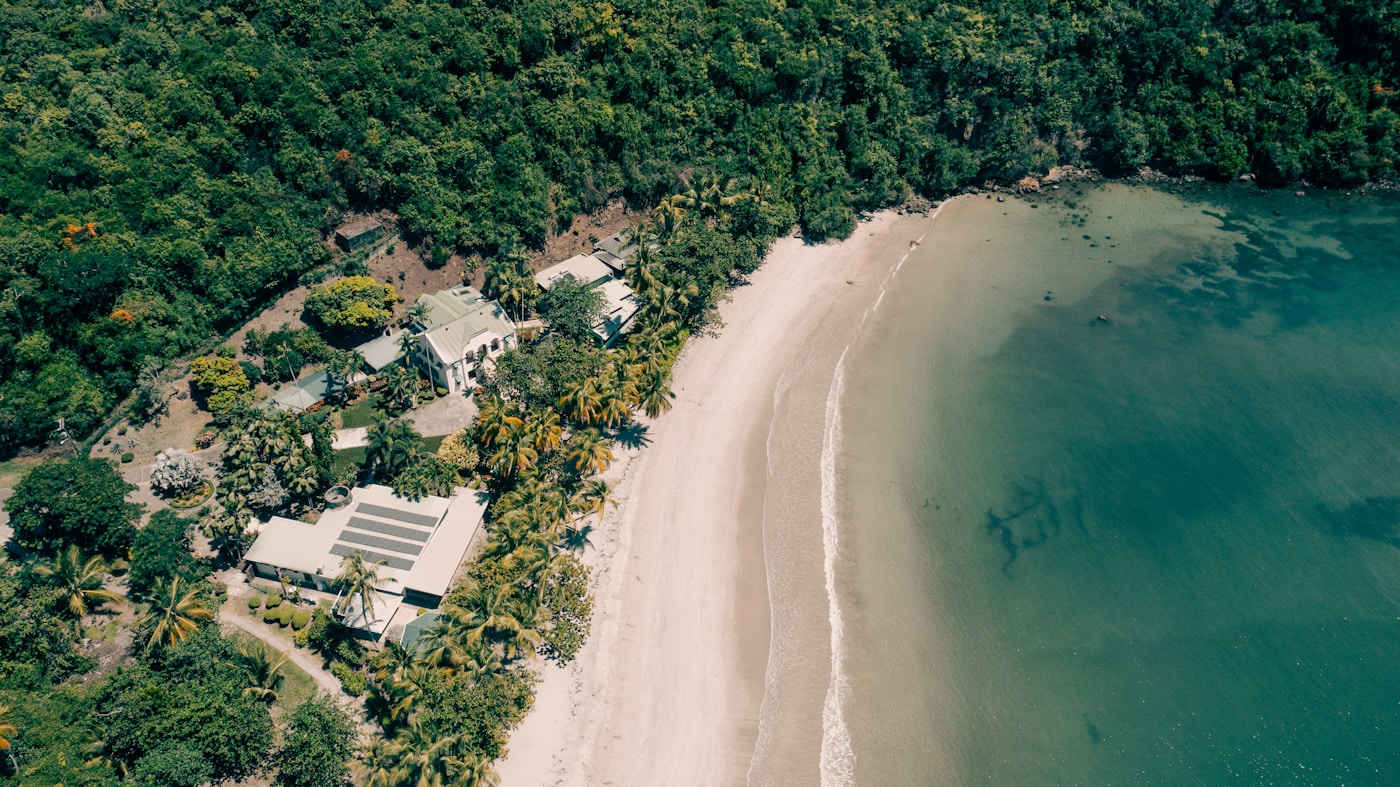 A lush Grenadian coastline surrounding a quiet beach